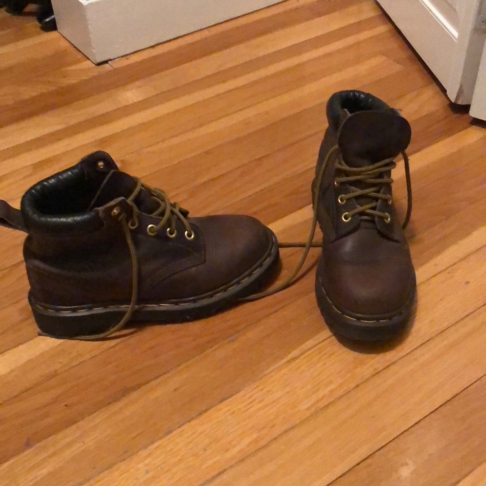 Dr Martens high top shoe.